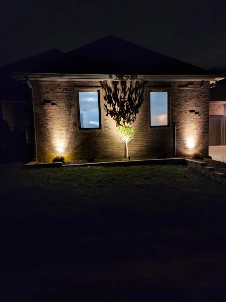 Architectural uplighting on a residential home at night